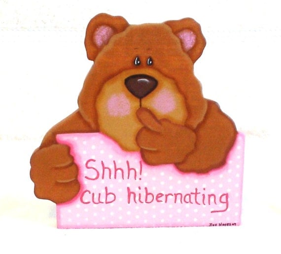 Hibernating pink bear cub wooden sign
