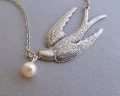 Silver Soaring Bird Necklace With Dangling Pearl