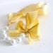 The Original Carrie Necklace in Sunny, a romantic yellow ribbon and pearl bridesmaid necklace