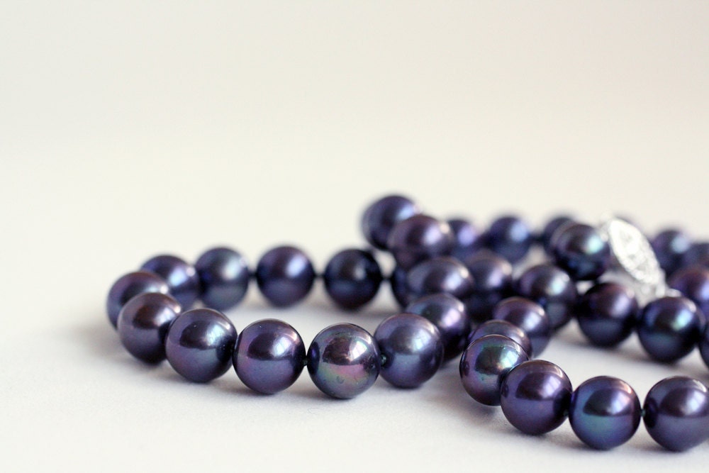 Large knotted blue-black pearls