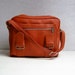 RESERVED vintage orange vinyl carry on duffel bag