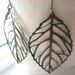 falling leaf earrings. antique bronze filigrees.