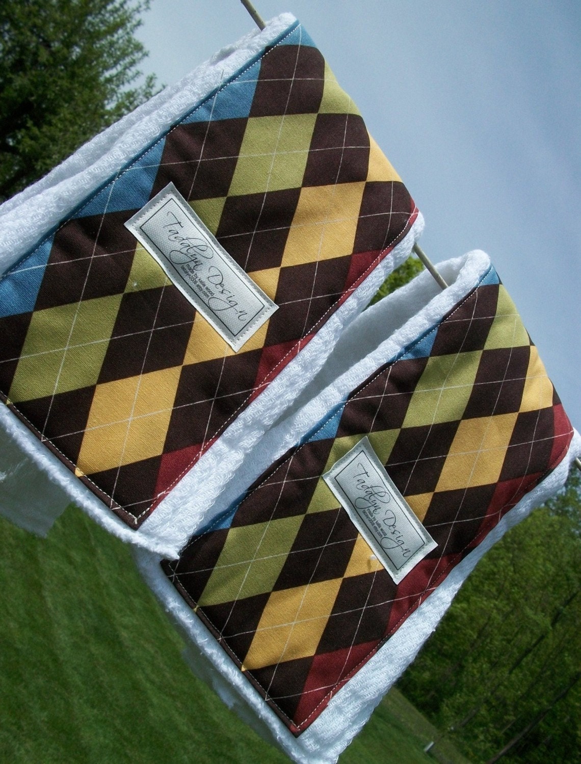 Two burp clothes. Argyle with brown, yellow, green, blue and red. Awesome pattern.