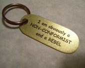 Non conformist keychain for a Rebel etched in Brass