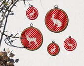 Acrylic doily deer hoop wall art hanging on red polka dots