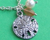 Beachcomber's Sand Dollar Charm Necklace with pretty peach glass bead imitation pearl and silver chain
