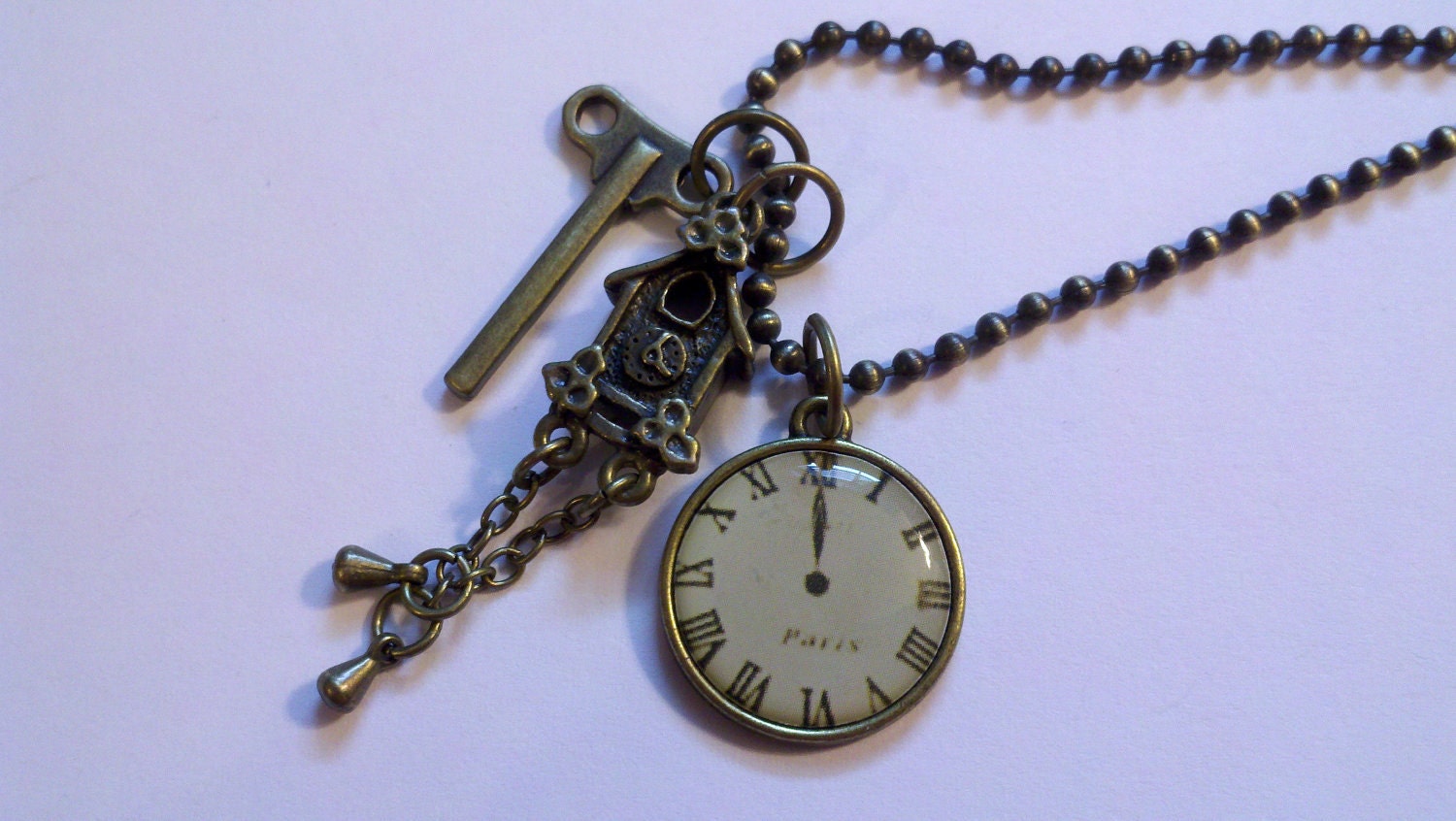 Antique Brass Large Clock with cuckoo clock and wind up key on an 24