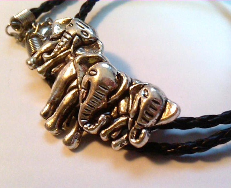 Large s/p elephants on a black 18 inch faux braided leather necklace cord