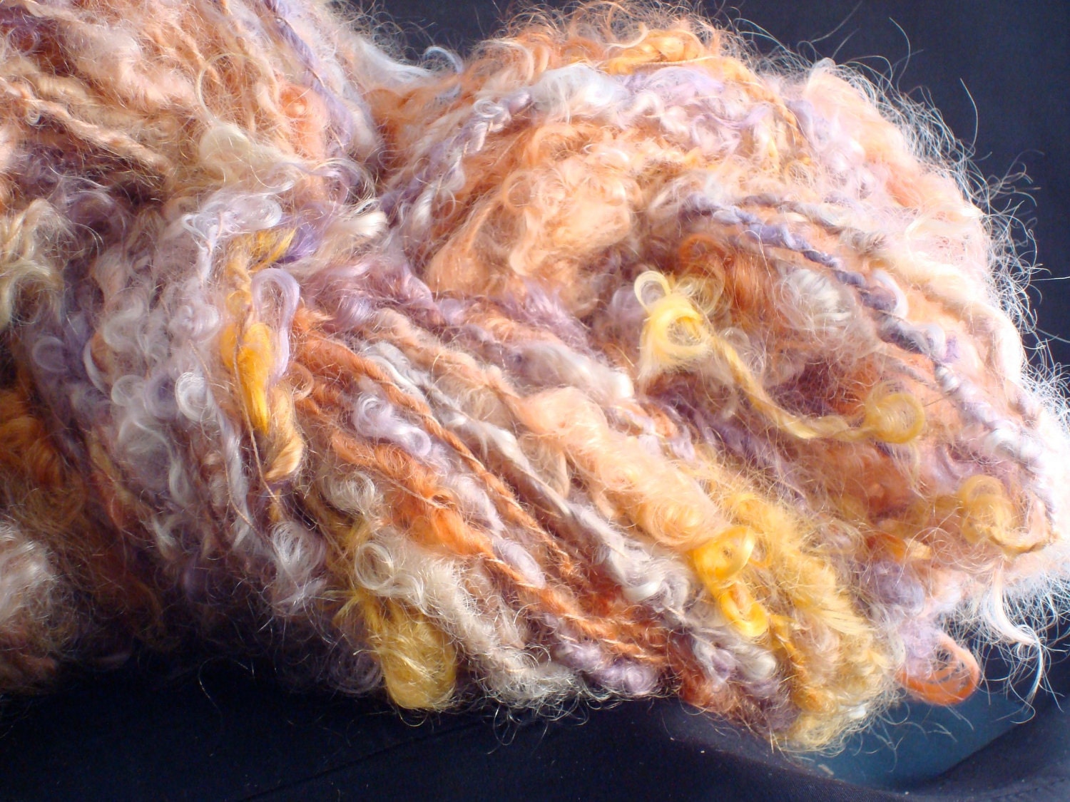 Lavender, peach, orange, coral sunset color chunky bulky texture handpainted handspun mohair yarn