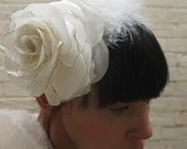 White wedding rose and feather headpiece for a bride made from recycled satin