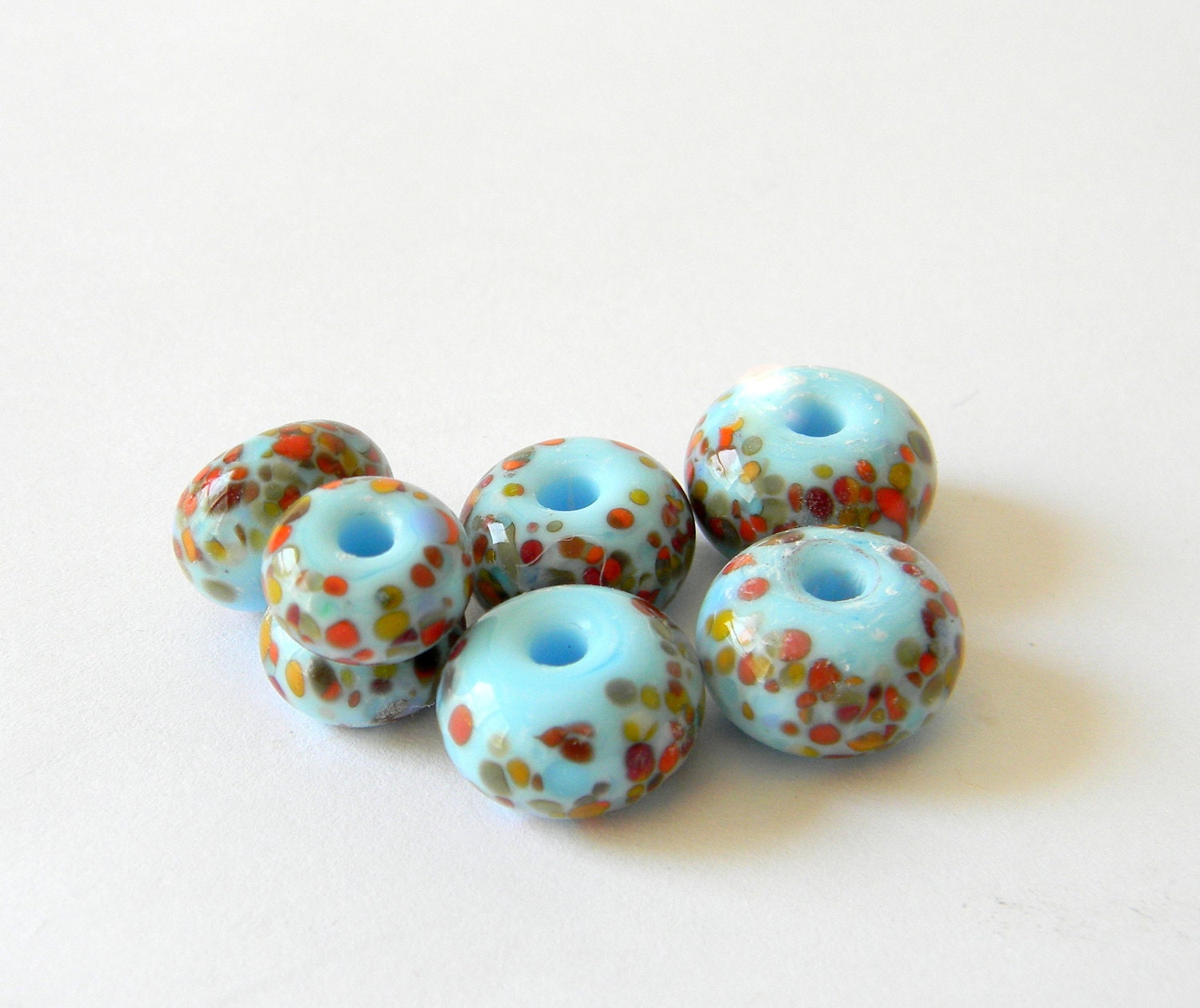 Lampwork Glass Beads (Set of 6) Handmade Frit of Reds, Yellows, Blues, Whites, Oranges on Light Sky Blue- Donut Rounds