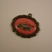 bird with nest no. 2 metal charm or pendant