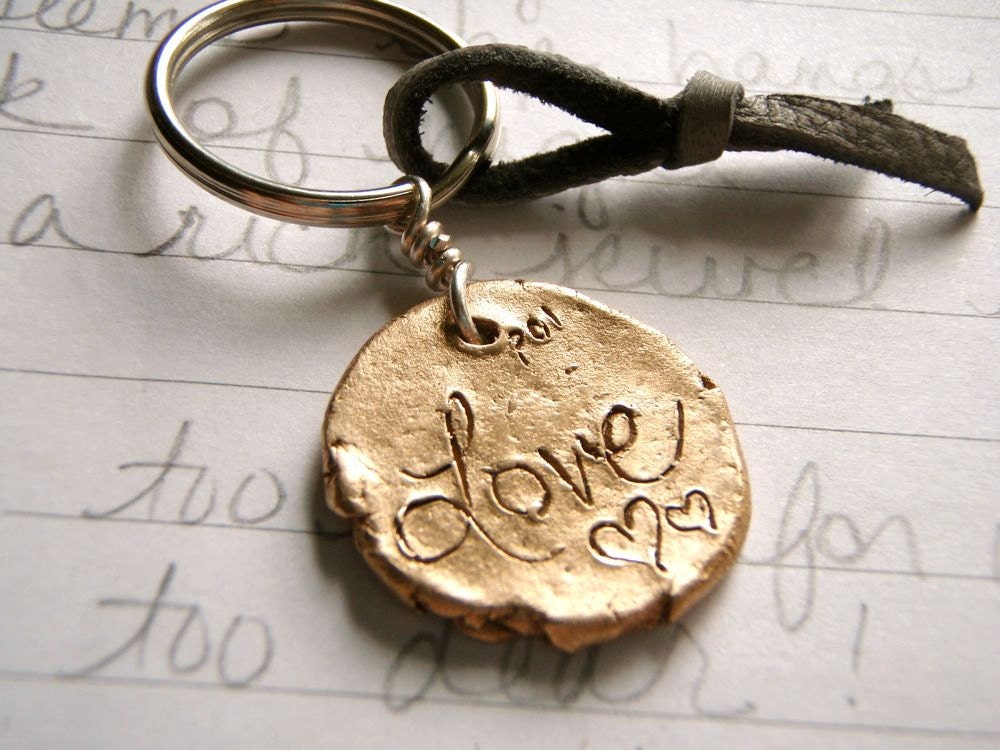 artisan bronze love keychain . recycled bronze love medallion and leather key ring . ready to ship gift