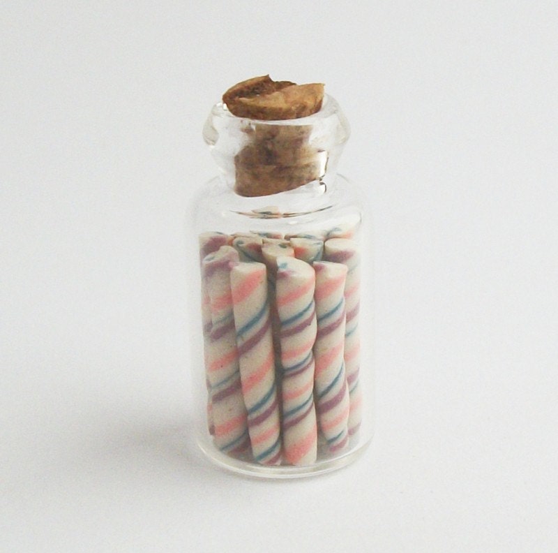 Miniature Jar of Pink, Purple, and Blue and White Candy Sticks