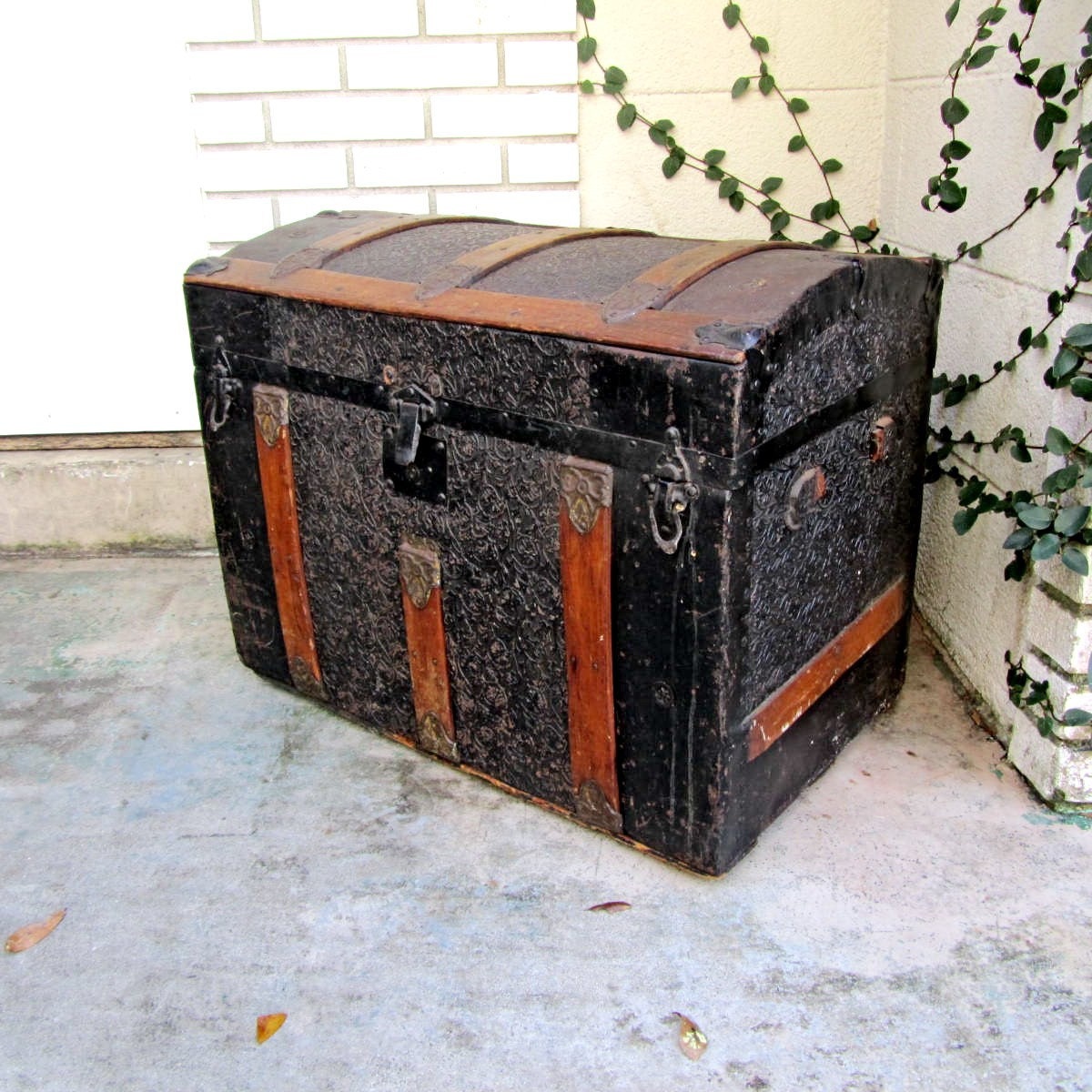 Antique pressed tin dome top steamer trunk