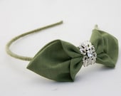 green bow headband with silver center