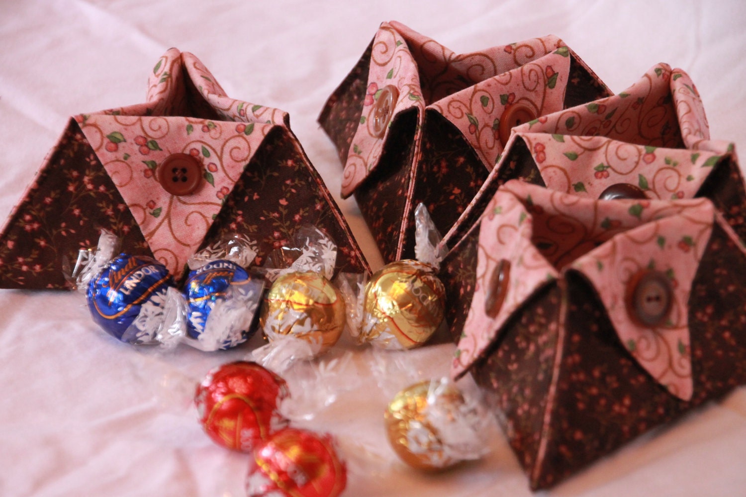 Set of four pink and brown fabric baskets
