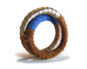 Infinity bracelet in blue, tan and gold leather