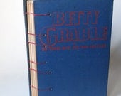 SALE Betty Grable and the House with the Iron Shutters, upcycled coptic journal