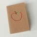 stitched moleskine notebook, red apple for the teacher (graph pages)