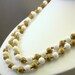 Vintage double strand white glass and gold metal beaded necklace