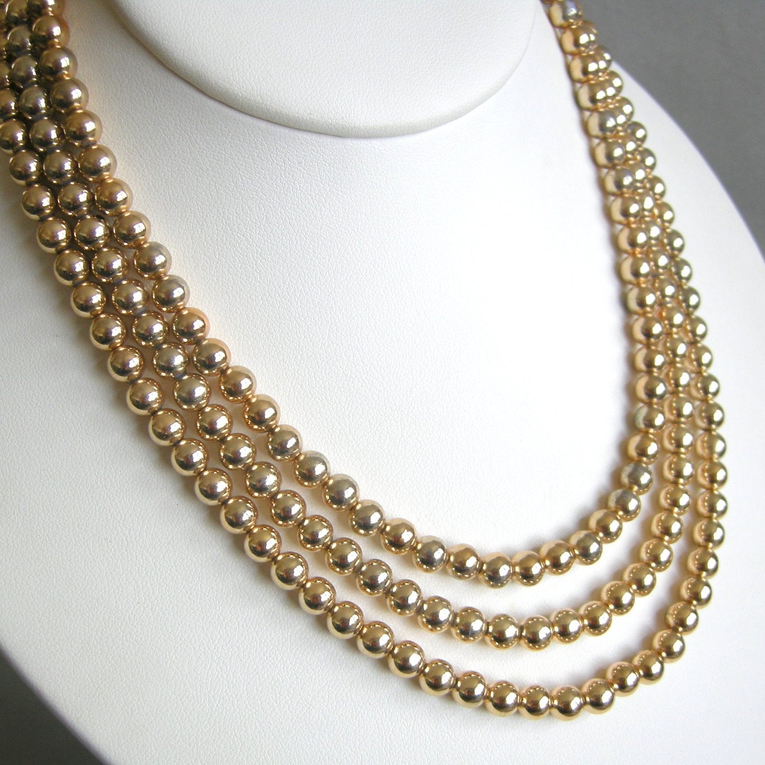 Vintage triple strand gold glass bead necklace
