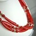 Vintage multi strand necklace with marbled red plastic