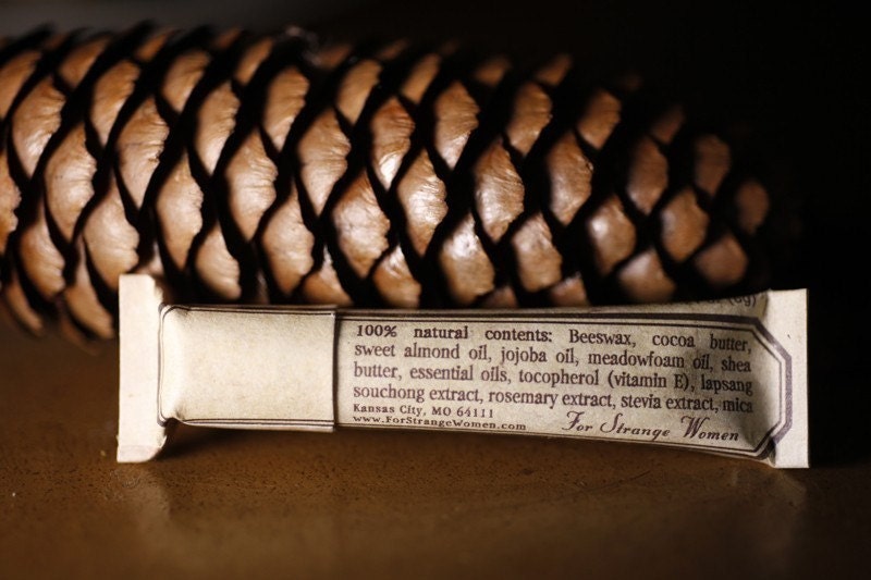 Pine Cone lip embellishment in eco friendly tube