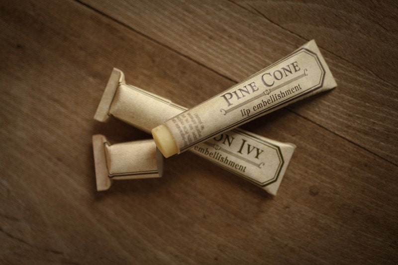 Pine Cone lip embellishment in eco friendly tube