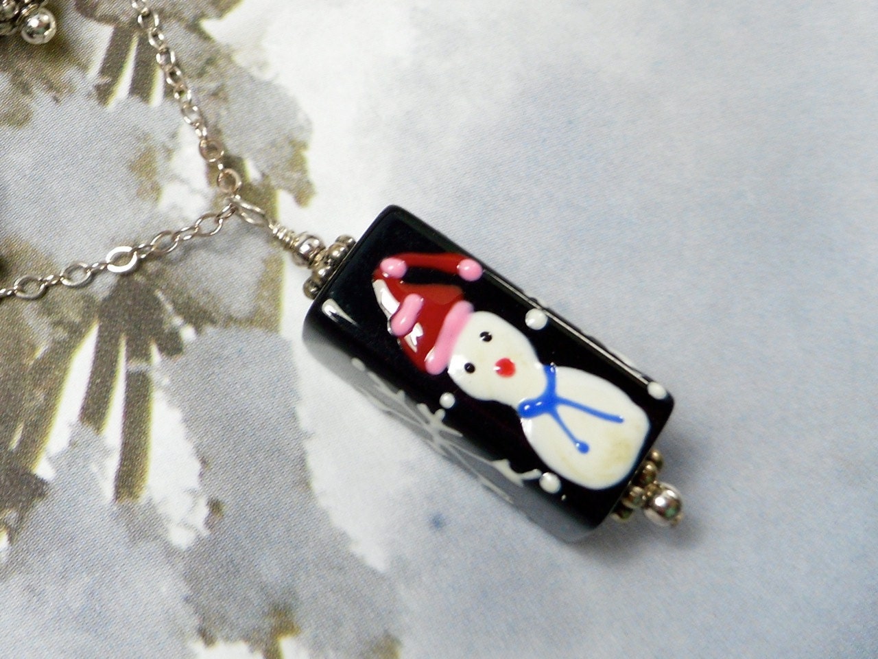Necklace - handpainted black glass with snowman and snowflakes on sterling silver chain - great holiday or christmas gift