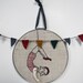 daring young girl on the flying trapeze- embroidery in red and charcoal