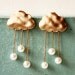 i heart rainy days . a cute whimsical rainy cloud earrings in gold .