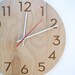 modern wood wall clock with beautiful natural woodgrain and classy modern numbers