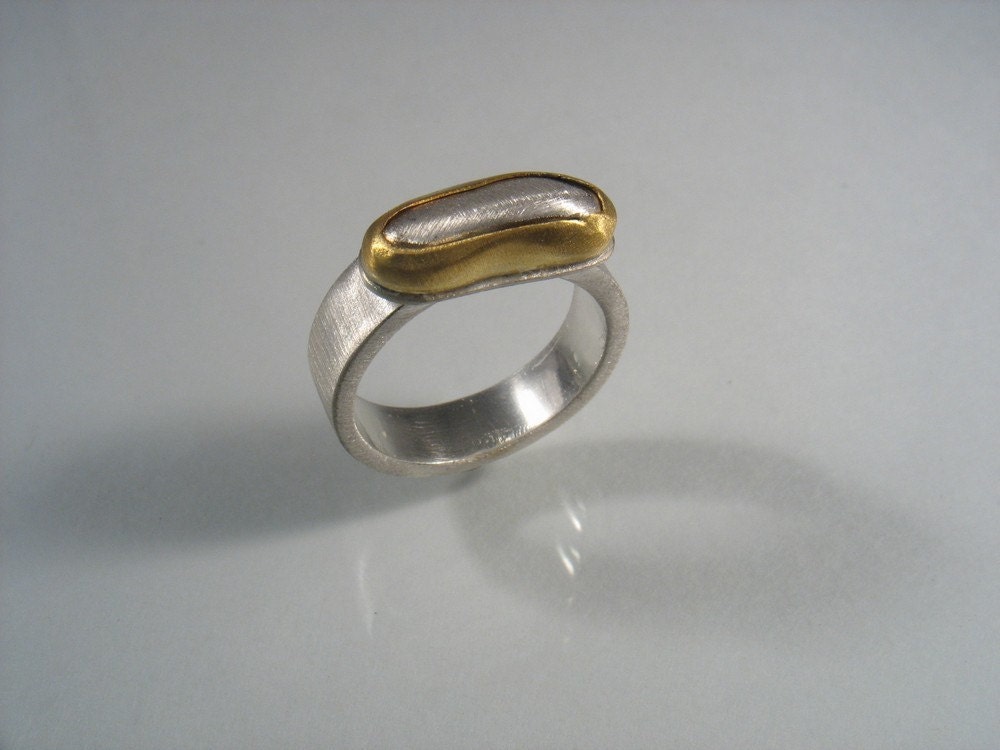The Narrow Organic Ring - matte silver band with oxidized and partly polished silver rock set in gold