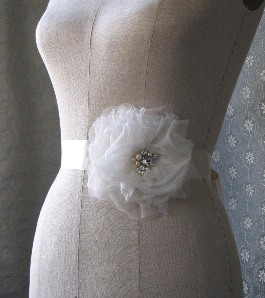 Silk Flower And Ribbon Sash In Cream And Champagne