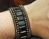 Black and Bronze five row Chan Luu style bracelet with ceramic button