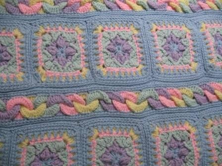 Fun tactile sensation Crochet Multicolored  baby/lap blanket with blue trim