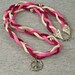 Code Pink - Pink Red White Braided Ribbon Necklace with Floral Silver Peace Sign
