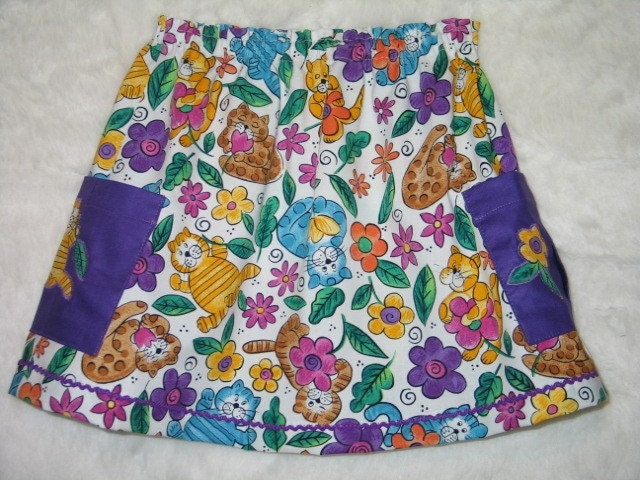 Cute skirt with cats,flowers with 2 pockets with a cat and flower  size 4-5