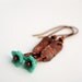 Rustic copper earrings with blue flowers