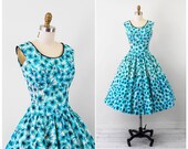 1950s dress / 50s floral dress / Blue, White, and Black Floral Print Dress with Black Velvet Bow