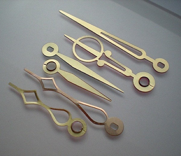 6 small fancy gold clock hands, No. 6