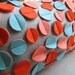 Disc Pillow in Dark Orange, Aqua and Coral