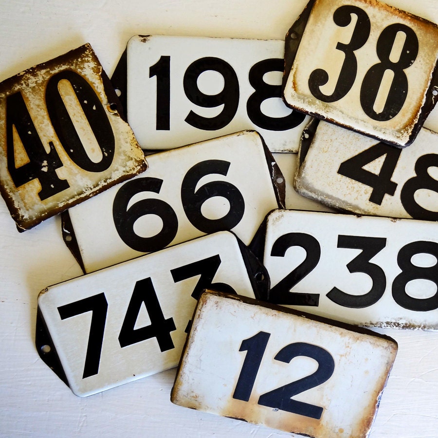 vintage enamel house number from Europe, number 12 black on white with great patina