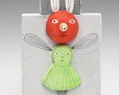 Tiny redheaded bug girl with green dress