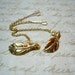Gold Wind Swept Leaf dangles on Gold Chain