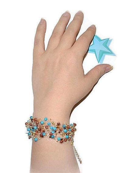 Airy crochet bracelet with turquoise and goldstone blue and brown country style
