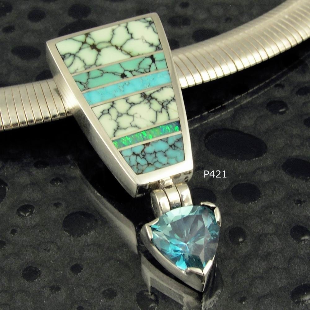 Hileman sterling silver pendant with trillion topaz and turquoise and opal inlay.