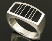Man's handmade sterling silver ring inlaid with black onyx.