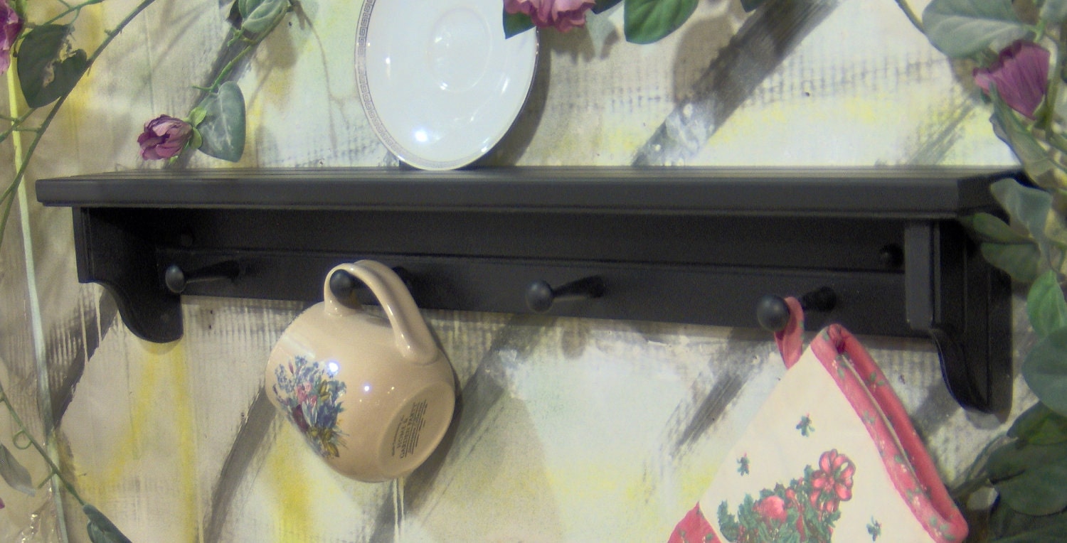 28" black wooden shelf for knik knack, plates  pegs made USA